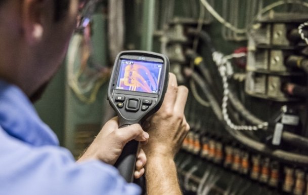 hays employee inspecting using tool