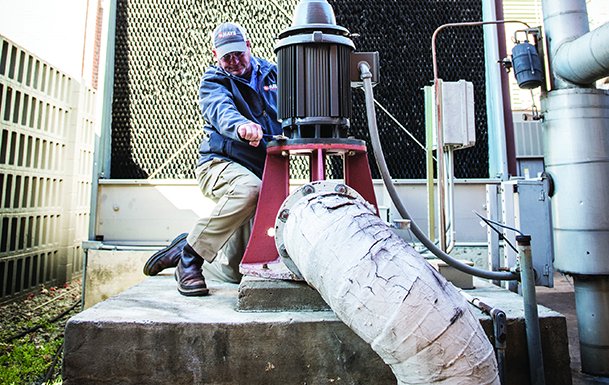 hays employee inspecting hvac unit