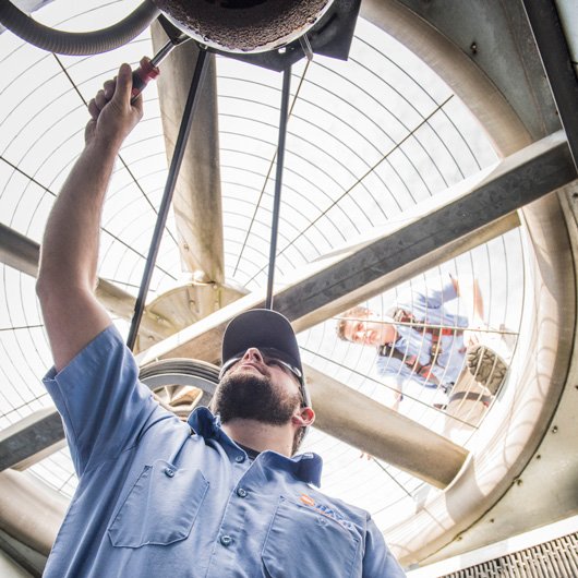 hays employee inspecting fan