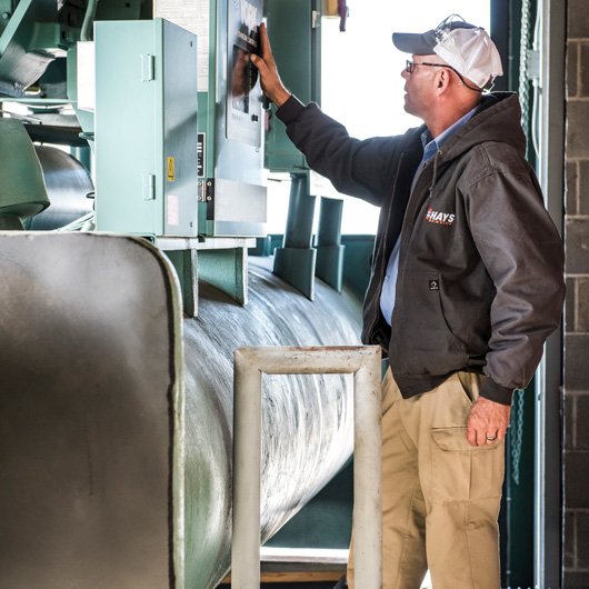 hays employee inspecting hardware