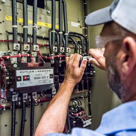 hays employee inspecting wiring